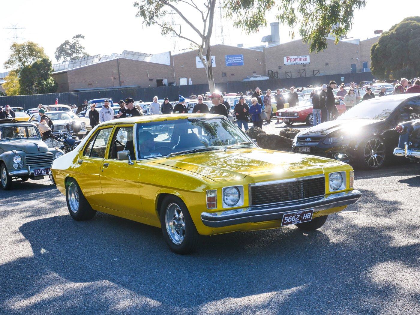 Bright yellow Holden HQ