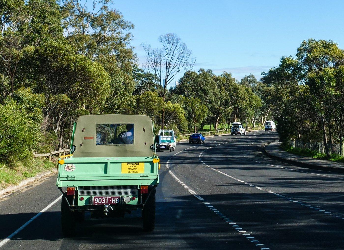 Line of Kei cars and trucks and a Haflinger