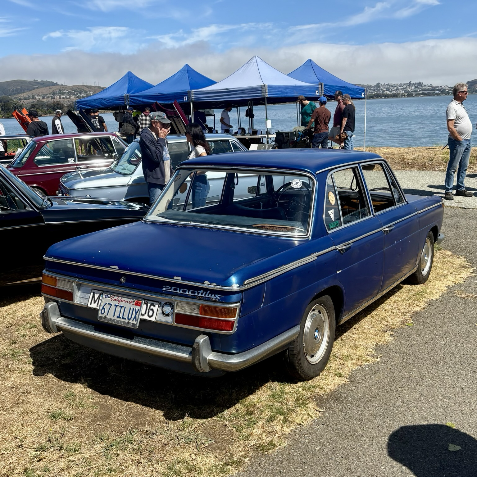 A blue 1967 BMW 2000 Tilux sedan, seen from a rear-3/4 angle.