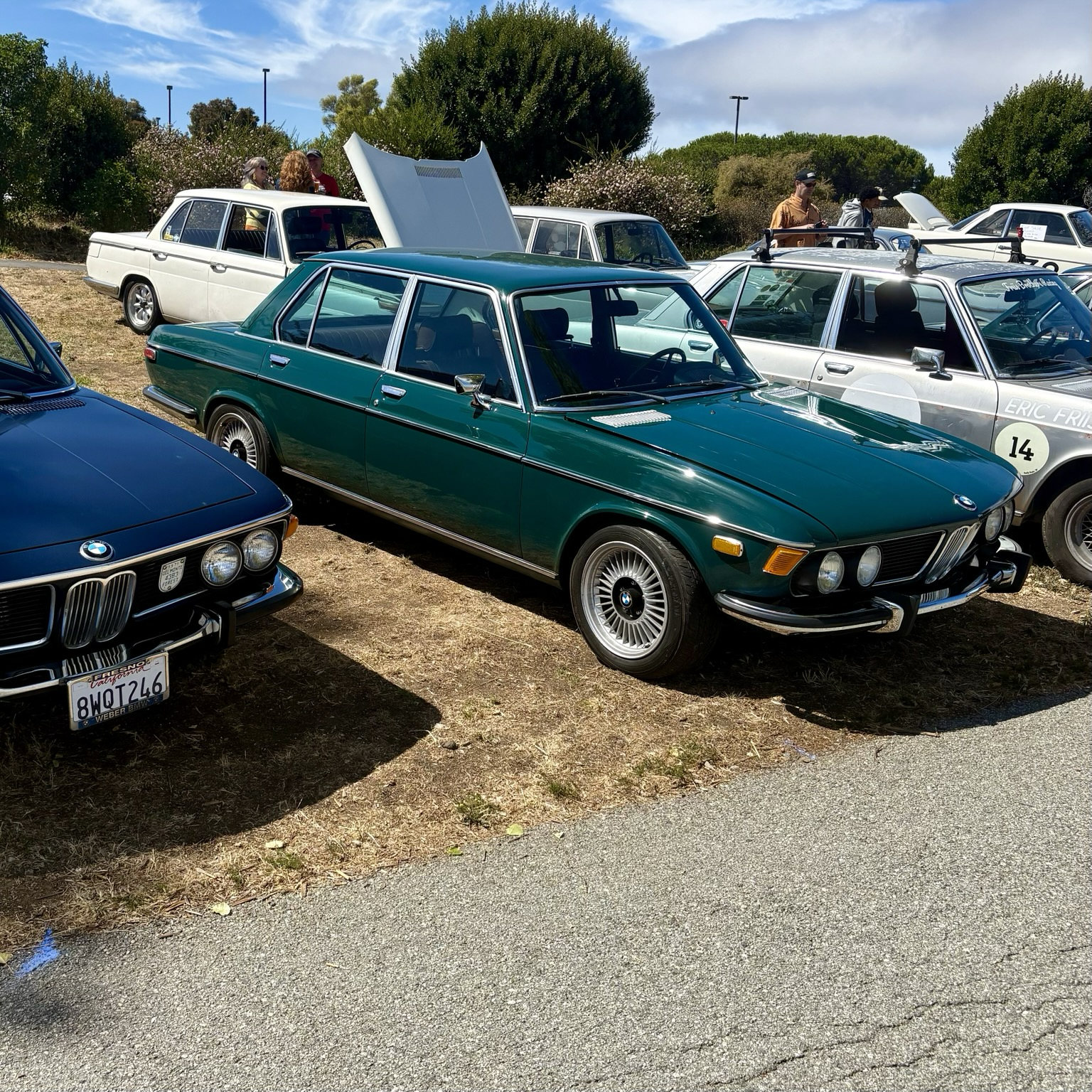 An Agave (green) 1973 BMW Bavaria sedan, seen from a front-3/4 angle.