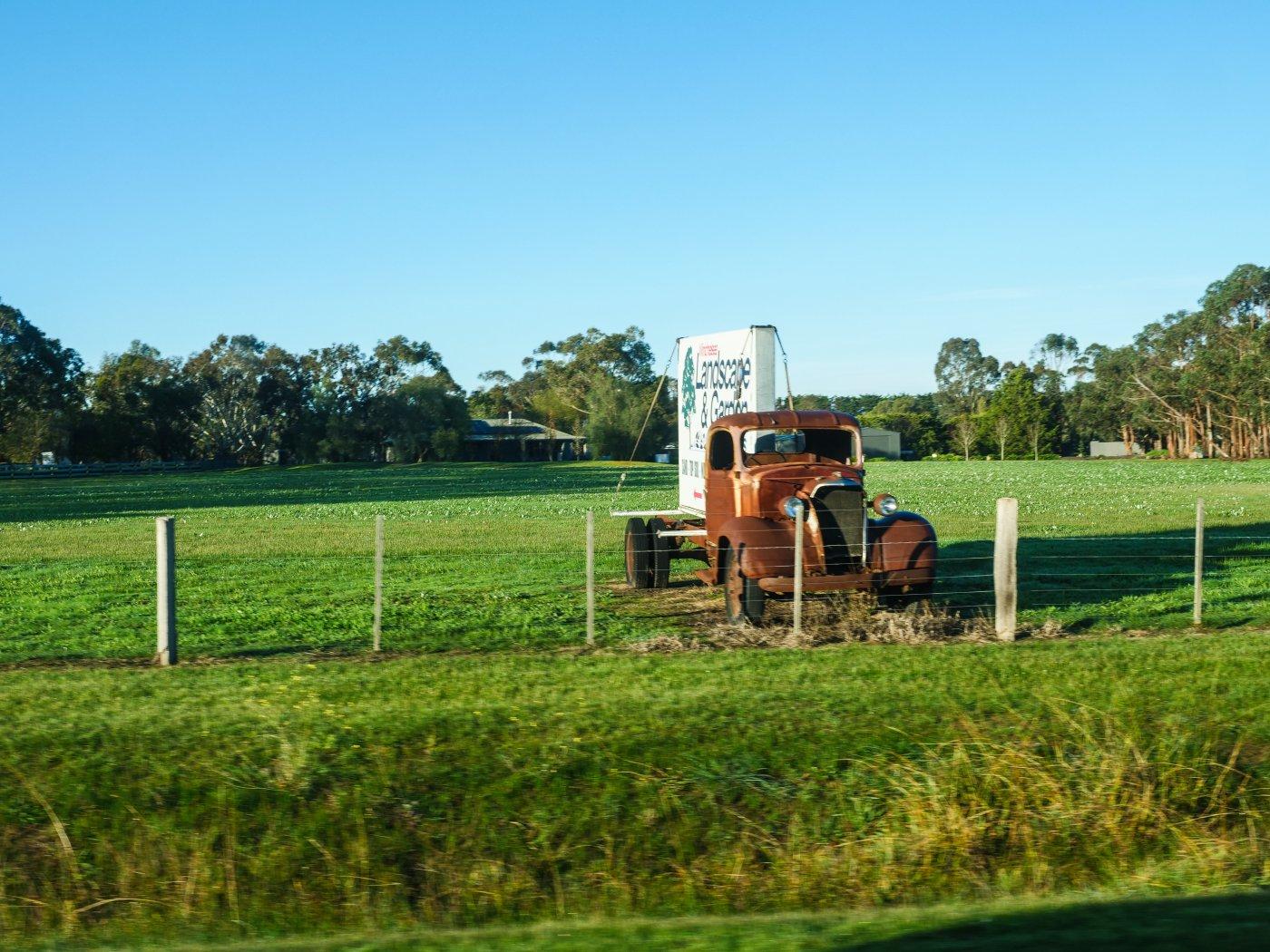 Old truck parked in a paddock